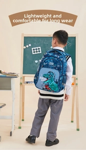Detail of ergonomic kid's backpack with green dinosaur print and mesh side pocket