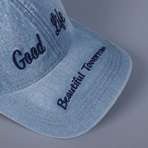 Washed blue denim baseball cap with Good Life embroidery and distressed vintage texture