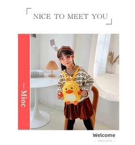 Detail of cute yellow duck mini backpack with 3D orange beak and side wing accents