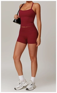 Close-up of burgundy high-elastic sports set featuring U-neck tank top and tight shorts