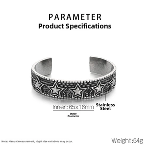Detailed macro view of vintage stainless steel cuff with engraved star relief pattern