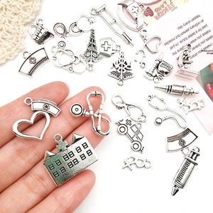 Detailed collection of silver medical themed charms including stethoscope and syringe for DIY crafts
