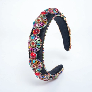 Baroque padded headband with colorful rhinestones and gold accents on black fabric