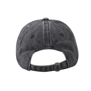 Detail of adjustable bronze metal buckle on vintage washed cotton baseball cap