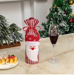 Close-up of red striped knitted wine bottle cover with 3D Santa and silk ribbon tie
