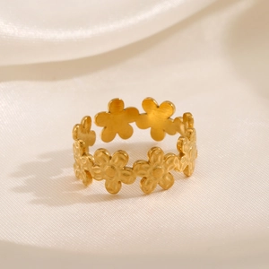 Adjustable golden stainless steel open ring with elegant floral pattern on silk background