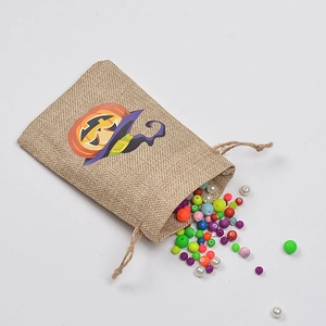 Halloween burlap drawstring gift bag featuring a pumpkin wizard print on a white background
