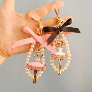 Ballet dancer keychains with pearls and rhinestones in pink and white dress designs