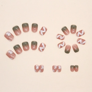 Green gradient floral press-on nails with delicate pearls and 3D ribbon textures
