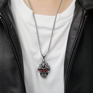 Men's retro skull pendant necklace with red eye stones in hip-hop style on model