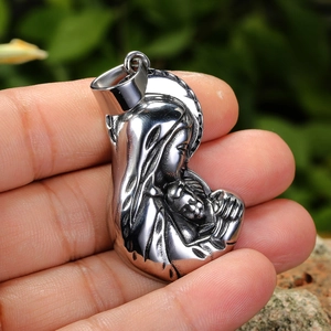 Polished silver stainless steel pendant featuring the Virgin Mary and Child in natural light