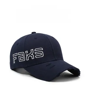 Detailed view of 3D FBXS embroidery and distressed brim on navy blue baseball cap