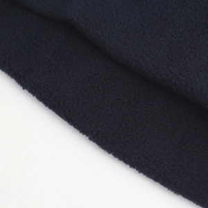 Macro view of dark blue fleece fabric showing soft texture and thermal lining detail