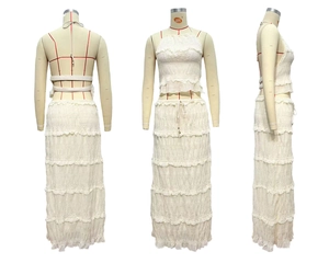 Three-sided view of a white two-piece chiffon set with ruffled crop top and tiered skirt