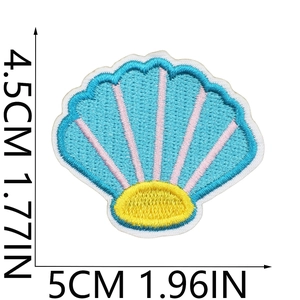 Blue and pink embroidered seashell patch with detailed stitching on white background