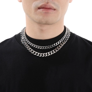Silver stainless steel double-layered Cuban link necklace set on a male model