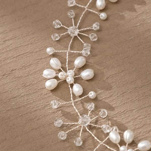 Handmade bridal headband with white ceramic flowers, pearls and crystals on silver wire