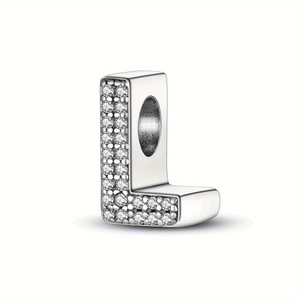 Detailed view of silver letter L charm with pavé cubic zirconia setting for DIY jewelry