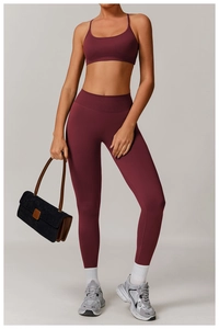 Deep red seamless yoga set with high waist leggings and thin strap sports bra for gym
