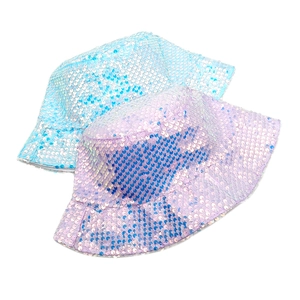 Detailed view of shimmering sequins on blue and purple reversible bucket sun hats