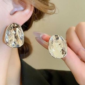 Modern minimalist irregular hammered texture silver earrings for women in professional styling