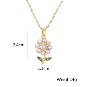 Detail of gold floral pendant necklace with pearls and zircon showing 2.4cm height