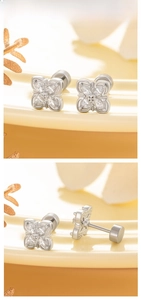 Detail showing four marquise zircons forming a silver flower stud with flat screw back