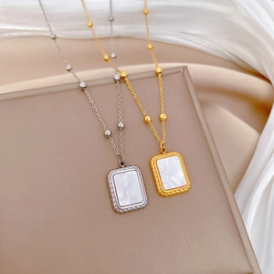 Minimalist square shell pendant necklaces in gold and silver finish on silk fabric