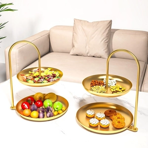 Luxurious gold double-tier snack tray with handle for serving fruits and desserts
