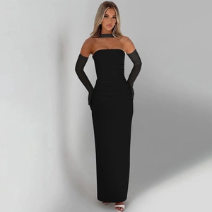Detail of elegant black strapless evening gown with sheer mesh gloves and long ribbons