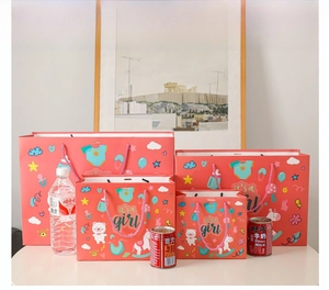 Size comparison of pink It's a Girl paper gift bags in four different dimensions