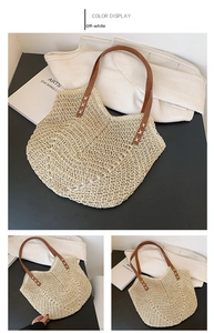Detail of handwoven cream white tote bag with brown leather handles and cross stitching