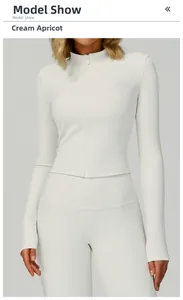 Detail of cream beige ribbed yoga jacket with slim fit design and vertical knit texture