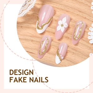 Almond-shaped fake nails with 3D white flowers, gold lines and pearls on wood