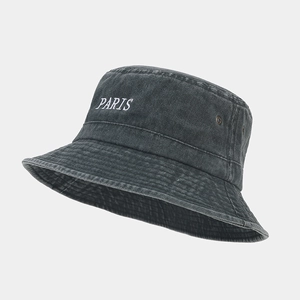 Detail of PARIS embroidery and metal eyelets on vintage washed cotton bucket hat