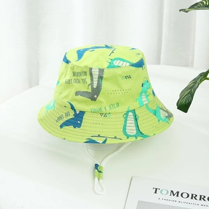Green kids bucket hat with blue cartoon alligator print and white adjustable drawstring