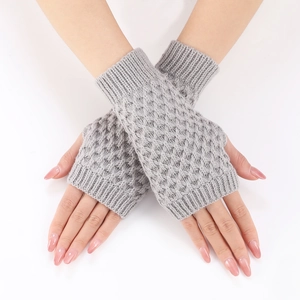Close-up of grey pineapple stitch knitted fingerless gloves showing diamond pattern texture