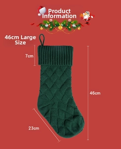 Detailed dimensions of a large green knitted Christmas stocking, 46cm height and 23cm width