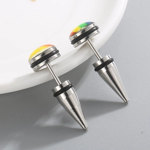 Detailed view of rainbow punk studs with cone backs and black O-rings on ceramic