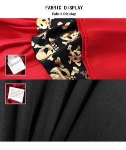 Detail of Halloween pirate costume fabric with gold skull print and polyester material label