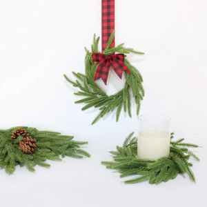 Artificial Norfolk pine needle wreath with red buffalo plaid bow and pine cones