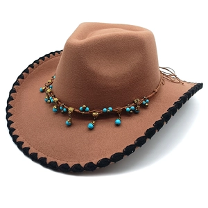 Detail of western felt hat with turquoise beads, bronze charms and braided edge