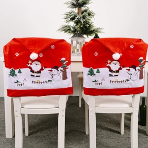 Festive red Christmas chair covers featuring Santa Claus and snowman patterns for dining decor