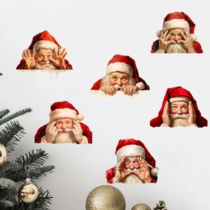 Detail of six festive Santa Claus wall stickers on a clean wall with holiday decor