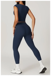 Back view of navy blue high-waist yoga set showing matte elastic fabric and fit
