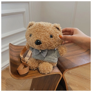Detail of cute brown plush bear crossbody bag wearing a grey hoodie with adjustable strap