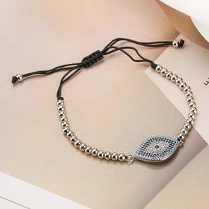 Detailed view of the Evil Eye charm bracelet with blue cubic zirconia and silver beads