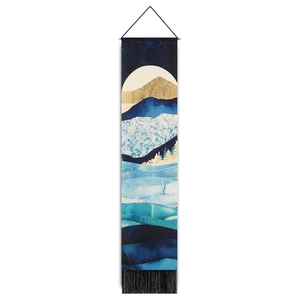 Artistic landscape tapestry with blue and gold mountains and elegant black fringe detail