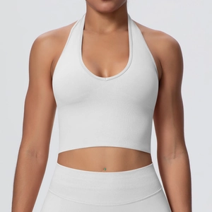 Detail of ribbed knit texture on white halter neck sports bra and yoga set