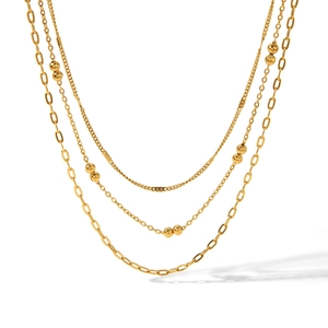 Three-layer gold stainless steel necklace set featuring chunky curb and bead chains
